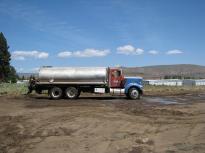Ted Check's water truck and grandson, Leshawn